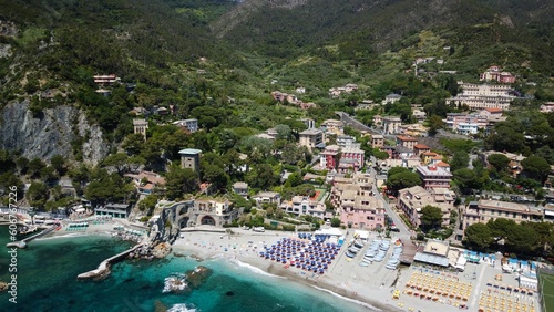 Aerial drone shot of the town of Monterosso al Mare, La Spezia, Italy surrounded by mountains