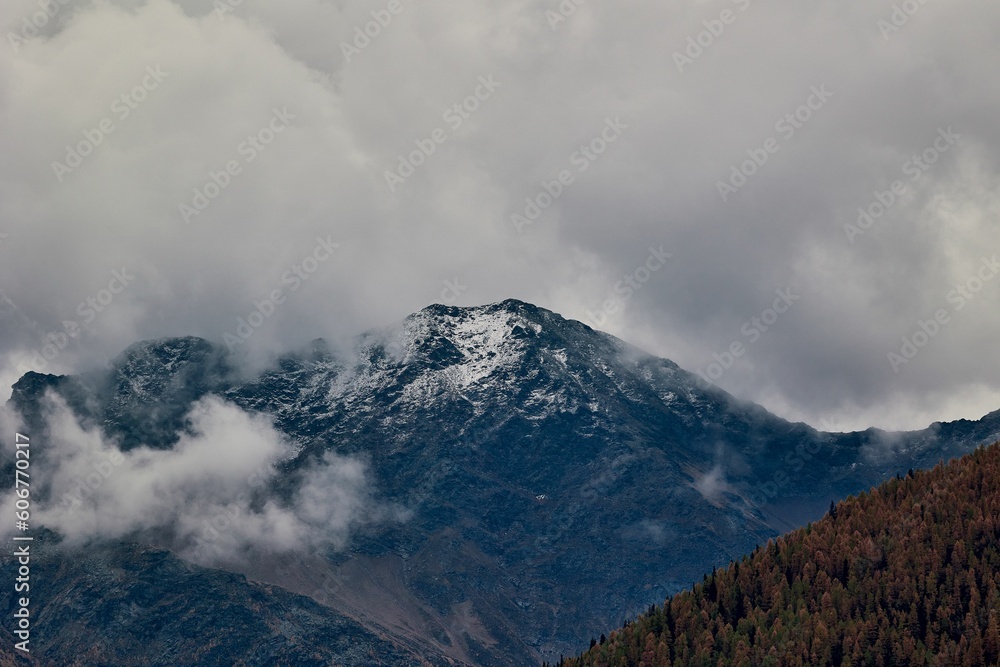 Aerial view of mountain landscape surrounded by dense trees Aerial view of mountain landscape surrounded by dense trees