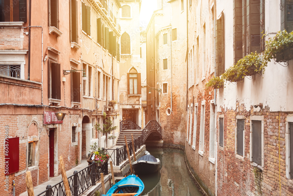 Narrow canal with gondolas in Venice, Italy