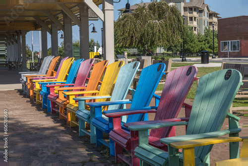 Colorful deck chairs lined in a row, no people.