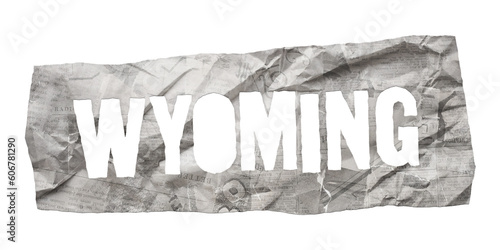 Wyoming state name cut out of crumpled newspaper in retro stencil style isolated on transparent background