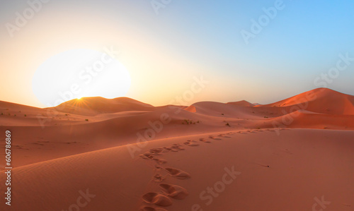 Sand dunes in the Sahara Desert at amazing sunrise, Merzouga, Morocco - Orange dunes in the desert of Morocco - Sahara desert, Morocco