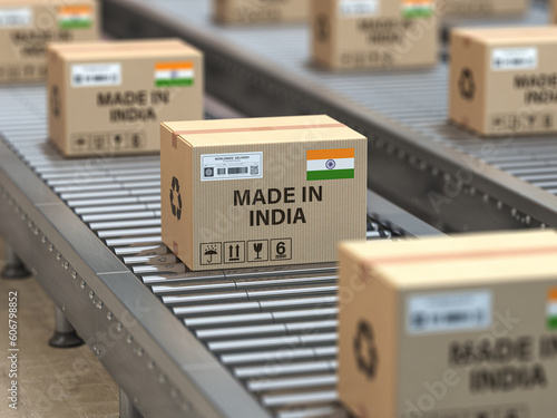 Made in India. Cardboard boxes with text made in India and  indian flag on the roller conveyor.