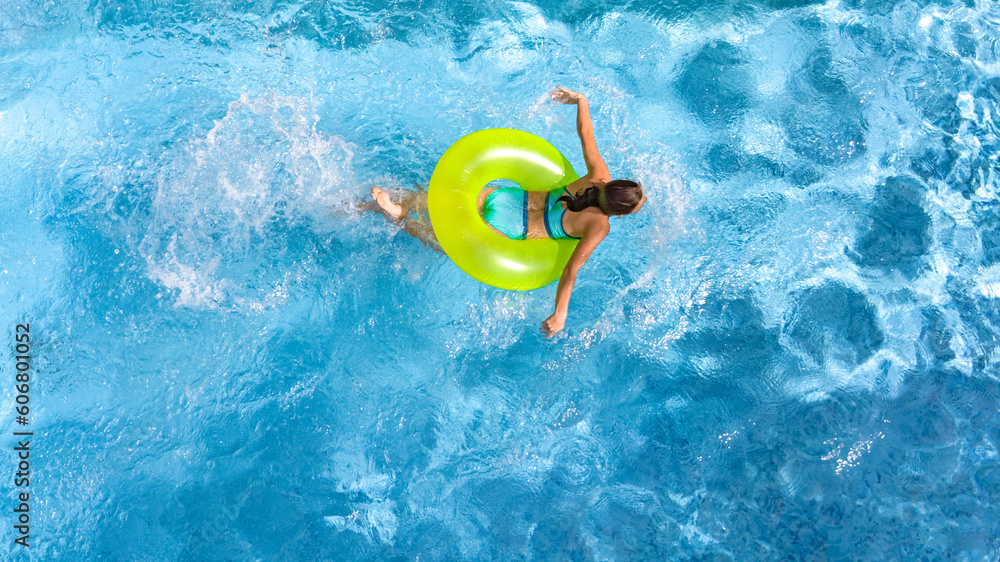 Φωτογραφία Active young girl in swimming pool aerial top view from above, teenager relaxes