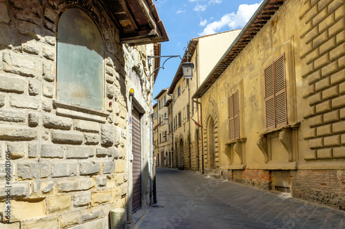 Street in historical center of Arezzo with facade of medieval buildings. Tuscany  Italy