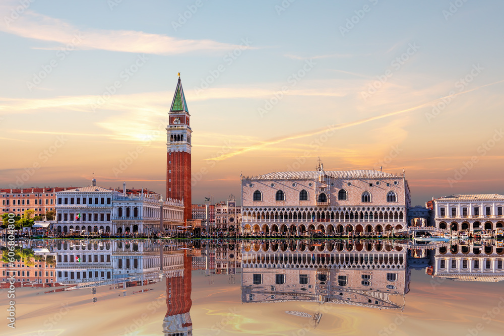 San Marco and Doge's Palace of Venice on the shore at sunset, view from the lagoon, Italy