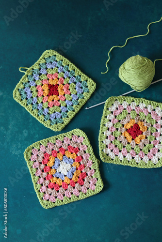 Handmade crocheted multicolored squares with embroidery patterns