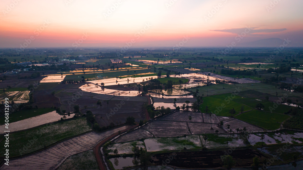 Top view of beautiful terraced rice fields in the water season and irrigation from drone evening light