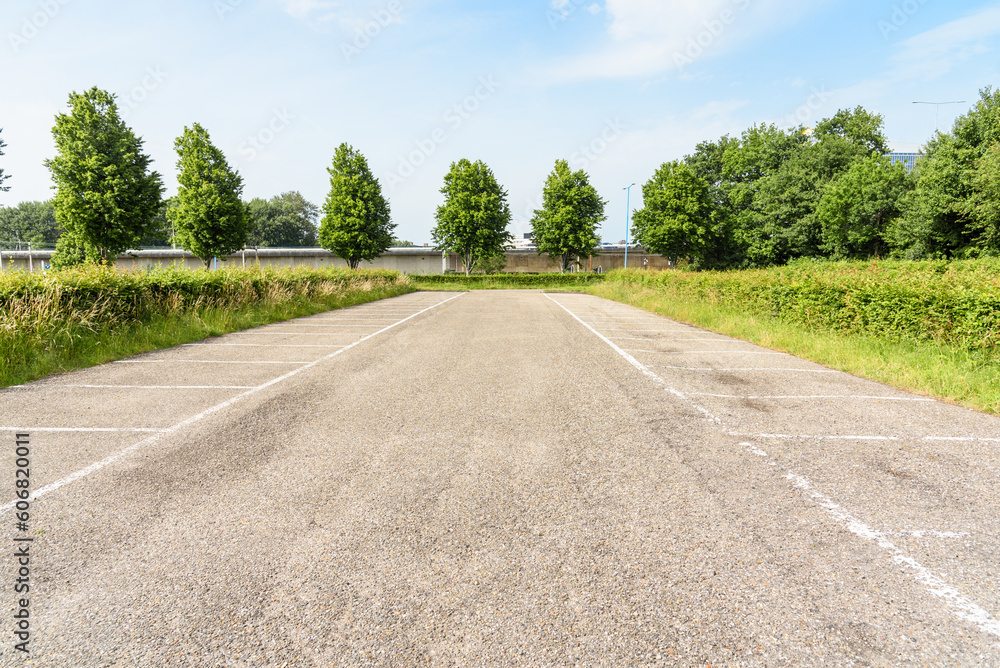 Empty parking lot at a suburban park and ride facility on a sunny summer day