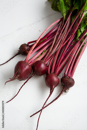Bunch of fresh beets root on light surface