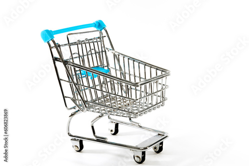 close-up of shopping trolley on white background with copy space