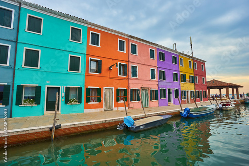 Colorful houses on the canal in Burano island, Venice, Italy. © Ryzhkov Oleksandr