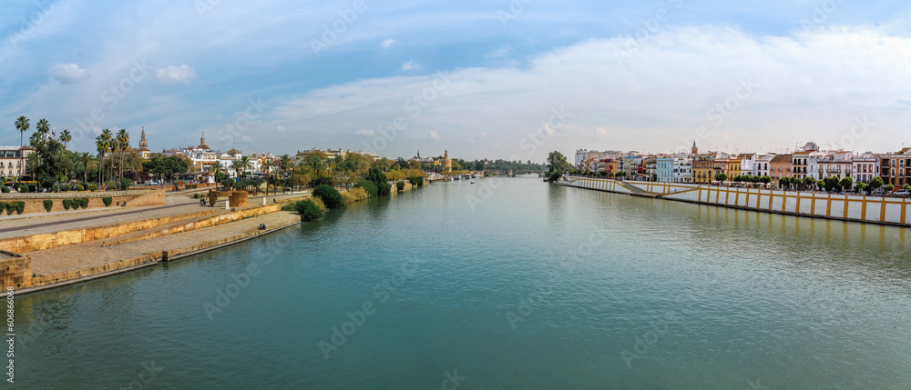 Panoramic view of Guadalquivir River with Triana and Torre del Oro (Golden Tower) - Seville, Andalusia, Spain