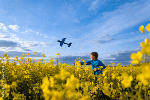A child launches an airplane