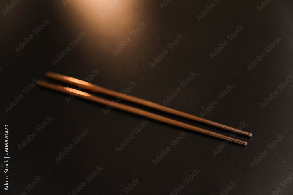metal utensils - spoon, fork, and chopsticks - representing culinary diversity, cultural traditions, and the joy of shared meals metal utensils - spoon, fork, and chopsticks - representing culinary diversity, cultural traditions, and the joy of shared meals