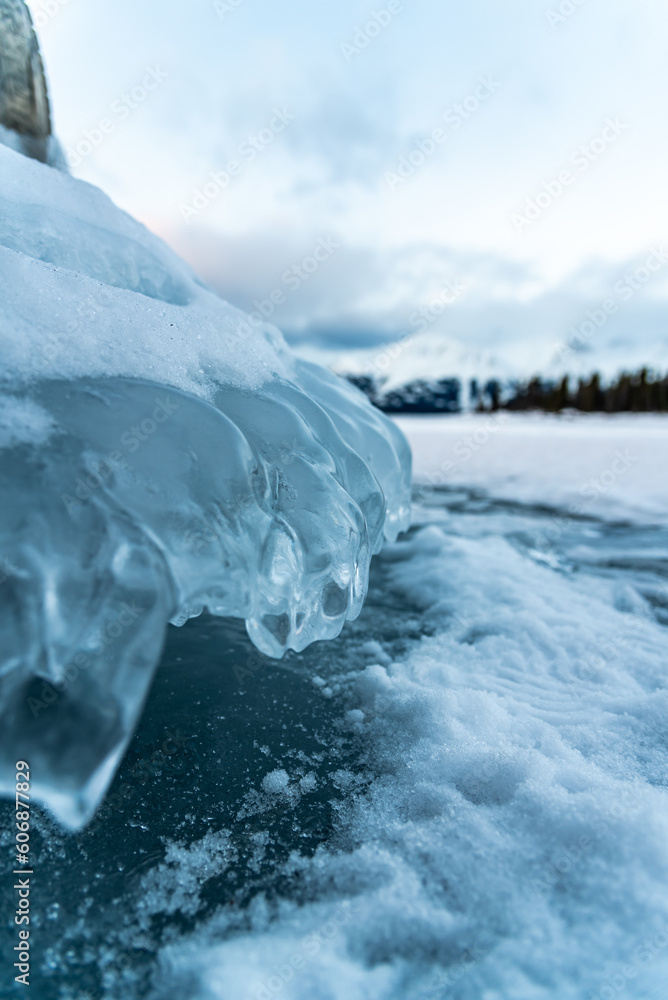 Obraz na plátně Ice mushroom formations seen in winter season time with snow capped mountains in distant background