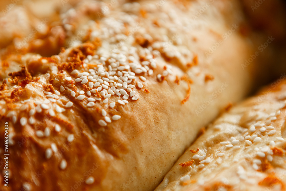 Close up shot homemade food baking concept. Fresh hot soft fluffy ginger golden brown sesame seeds buns pie bread dessert pastry in loaf pan. Bakery products, image with copy space.
Close up shot homemade food baking concept. Fresh hot soft fluffy ginger golden brown sesame seeds buns pie bread dessert pastry in loaf pan. Bakery products, image with copy space.