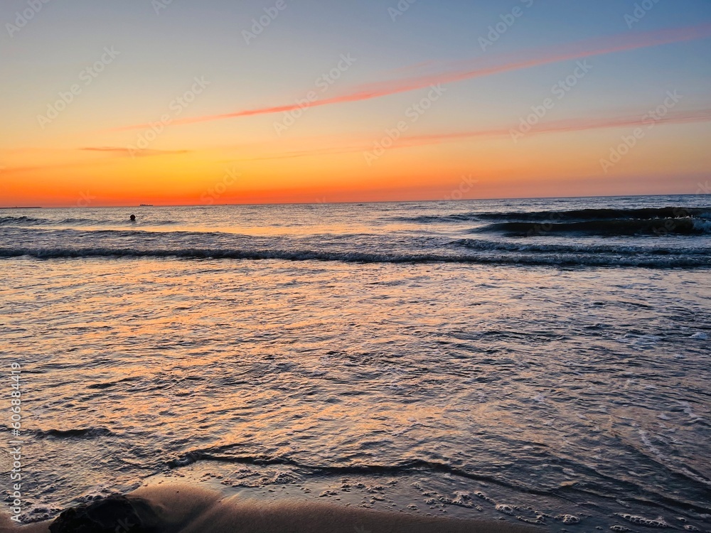 Orange sky after the sunset at the sea, evening sea horizon Orange sky after the sunset at the sea, evening sea horizon