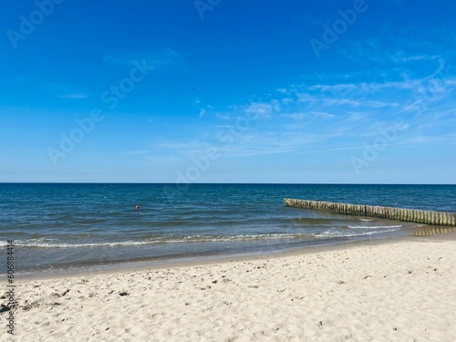 Blue seascape horizon, white sandy coastline