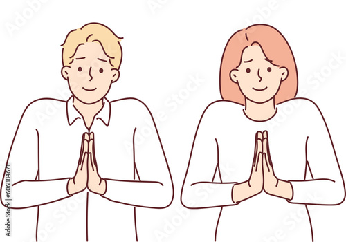 Foto Pair of angels pray with hands folded in front of chests and standing with halo