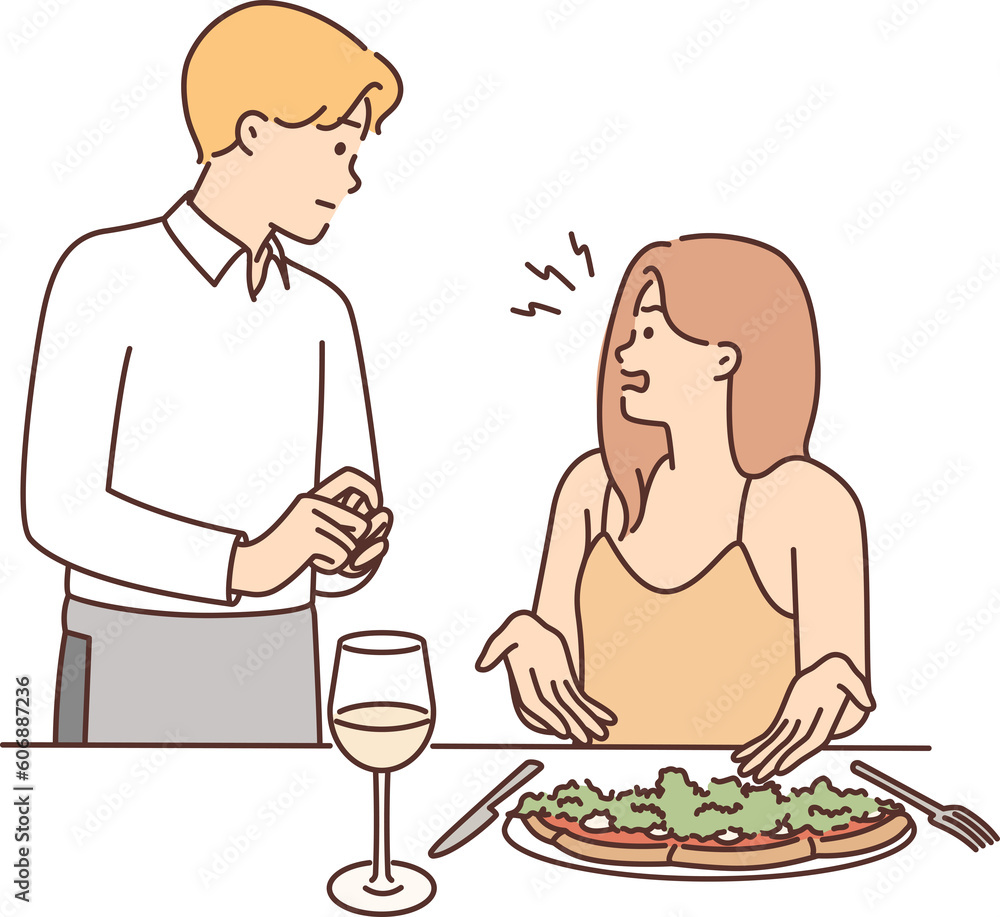 Restaurant visitor woman complains about quality of food and taste of served dish to waiter Restaurant visitor woman complains about quality of food and taste of served dish to waiter
