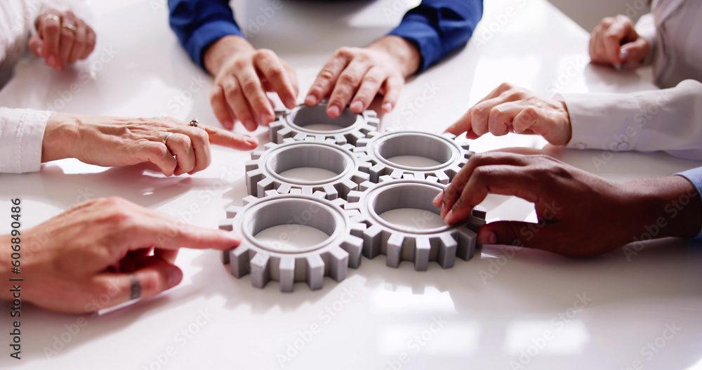 Fototapeta Diverse People Hands Holding Gear Wheels