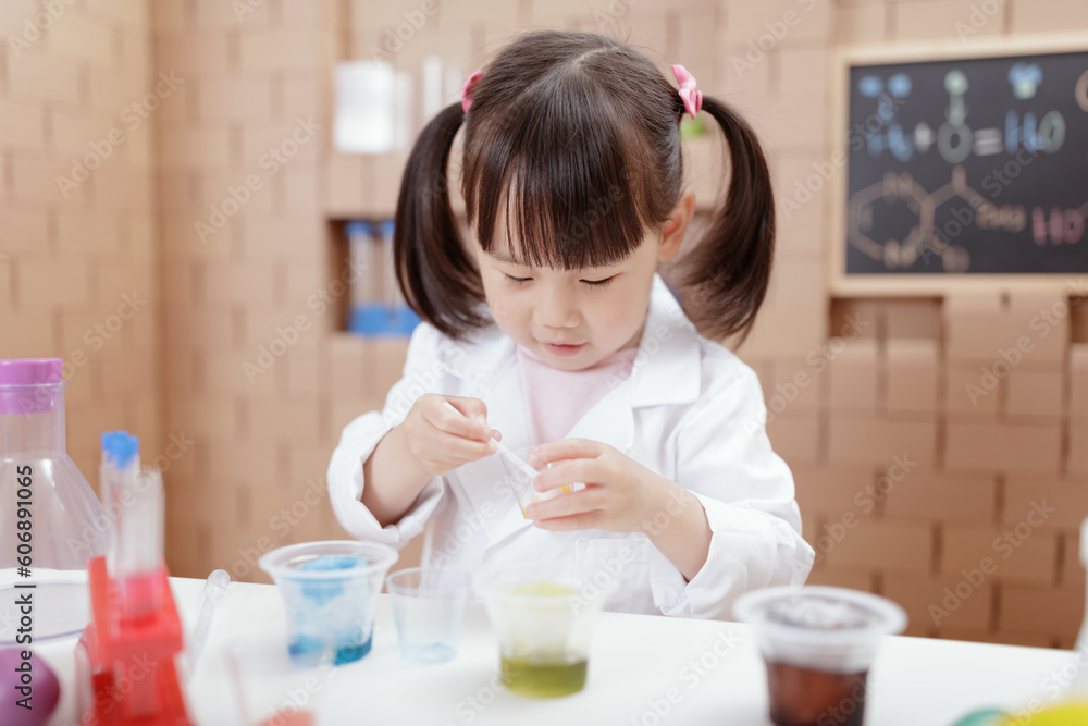 young girl plays science experiment for home schooling young girl plays science experiment for home schooling