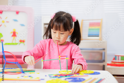 young girl was playing creative toys at home
