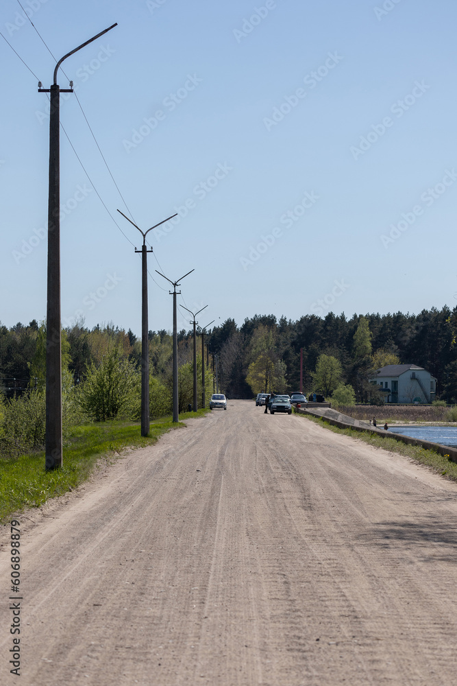 Fototapeta premium Beautiful rural road in the countryside, day landscape