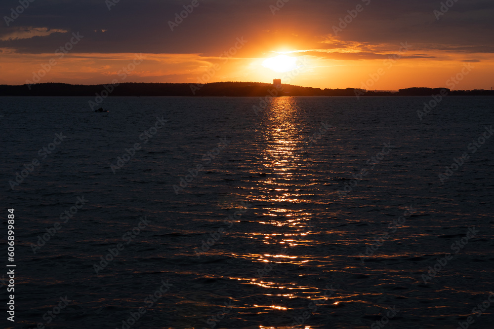 Fototapeta premium Evening landscape, sunrise or sunset on the lake or the sea