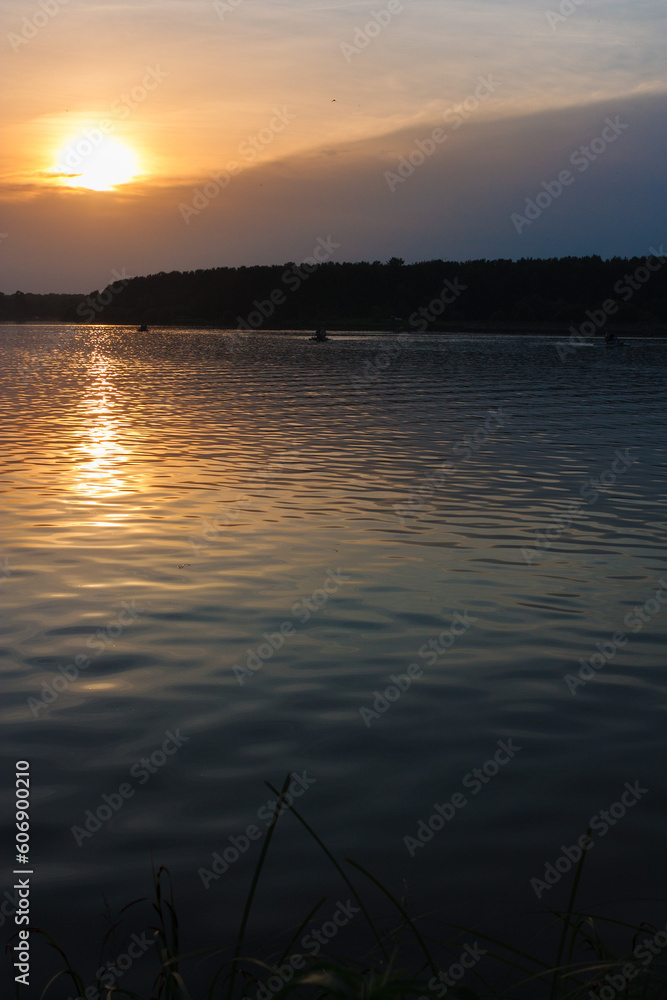 Evening landscape, sunrise or sunset on the lake or the sea Evening landscape, sunrise or sunset on the lake or the sea