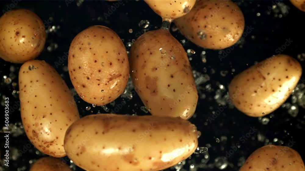 Potatoes fly up with water drops. Filmed is slow motion 1000 fps. High quality FullHD footage Potatoes fly up with water drops. Filmed is slow motion 1000 fps. High quality FullHD footage