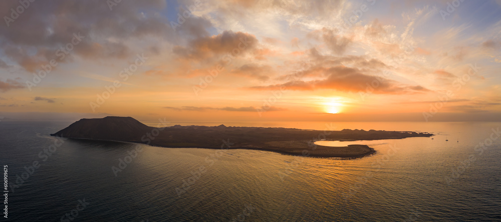 Warm sunrise high level aspect aerial panoramic image over the island of Lobos near Corralejo in Fuerteventura Canary Islands Spain Warm sunrise high level aspect aerial panoramic image over the island of Lobos near Corralejo in Fuerteventura Canary Islands Spain