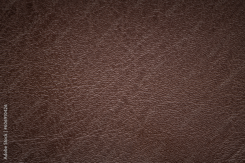 Brown artificial leather with large texture. Artificial skin. Close-up. Background. Texture. Brown artificial leather with large texture. Artificial skin. Close-up. Background. Texture.