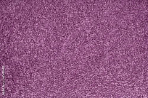 Purple artificial leather with large texture. Artificial skin. Close-up. Background. Texture.