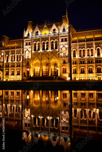 A fabulous nighttime photo of the illuminated facade of the parliament building in Budapest, reflected in the water