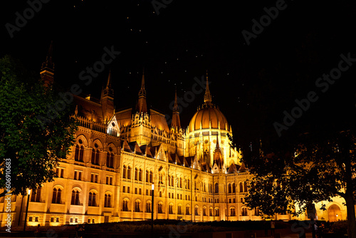 Evening photo of the Parliament building in Budapest.The majestic Saxon architecture is illuminated with warm yellow light