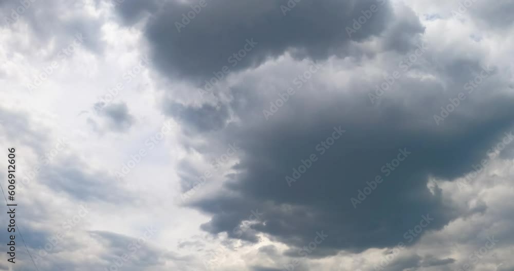 Stormy grey clouds accumulating in the atmosphere. Cumulus cloudscape formation in the sky from low angle view. Timelapse. Stormy grey clouds accumulating in the atmosphere. Cumulus cloudscape formation in the sky from low angle view. Timelapse.