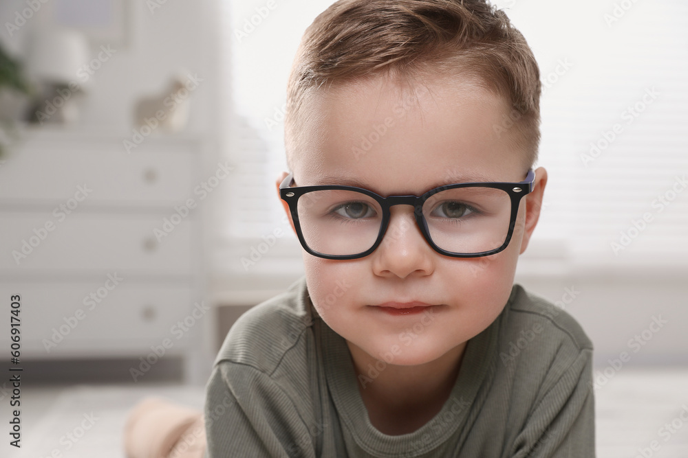 Cute little boy in glasses at home. Space for text Cute little boy in glasses at home. Space for text