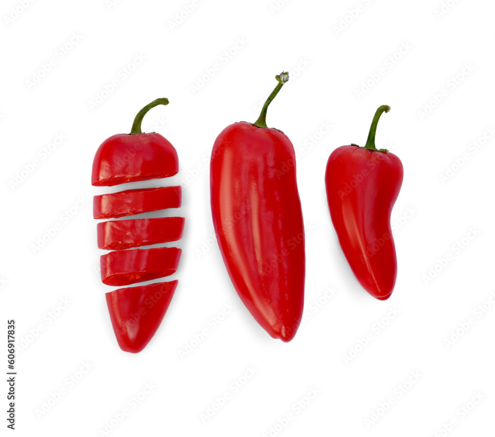 Whole and cut red hot chili peppers on white background, flat lay Whole and cut red hot chili peppers on white background, flat lay