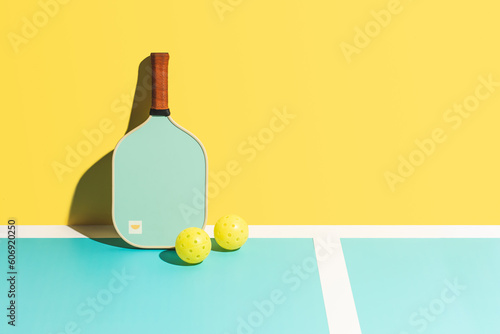 Pickleball Paddle and Ball Against Wall photo