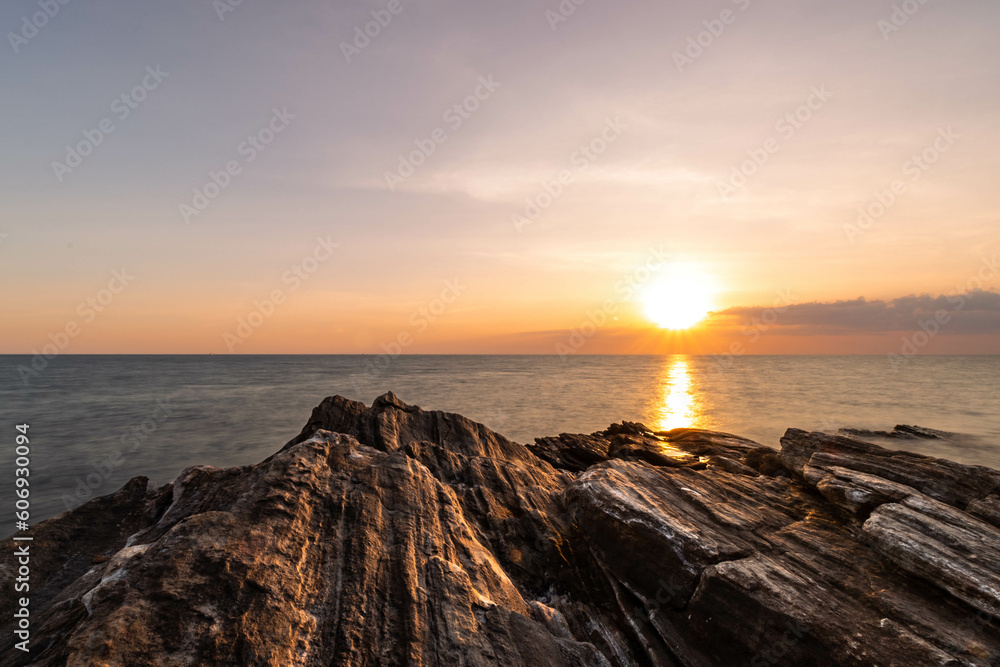 Fototapeta premium Sunset with layered rock at Khao Laem Ya National Park, Rayong, Thailand