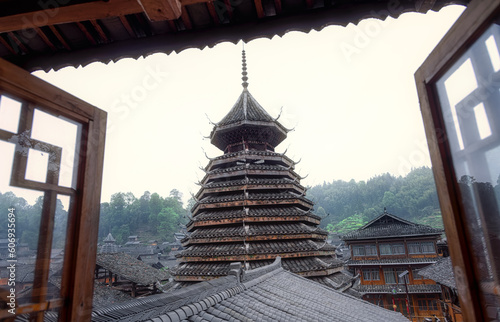 A drum tower through a window at Huanggang Dong village in Congjiang county, Guizhou, China. photo