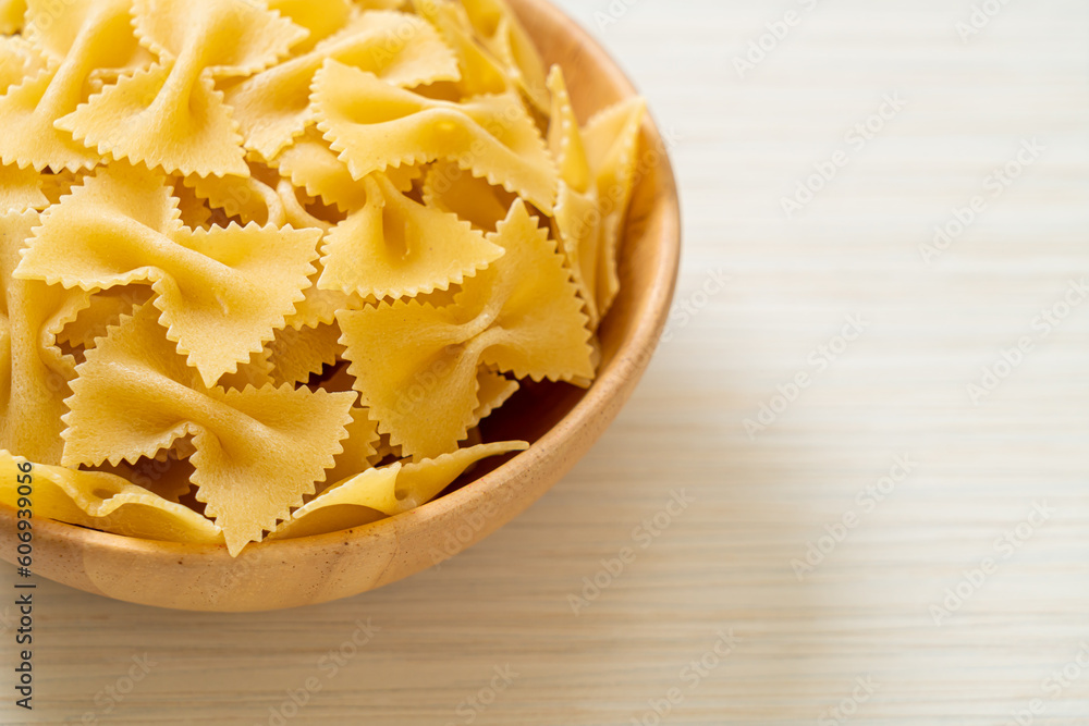 Dry uncooked farfalle pasta in bowl
