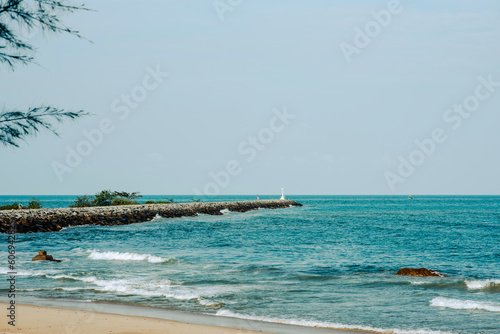 View of the sea and a lighthouse protruding into the sea