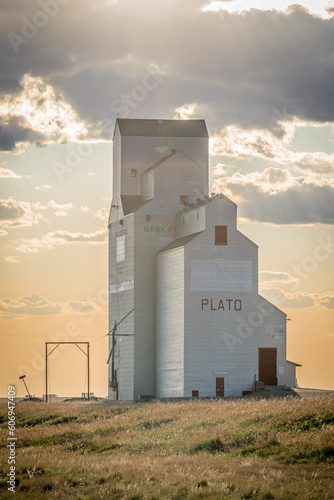 Sunset over an old grain elevator in the town of Plato, Saskatchewan, Canada 