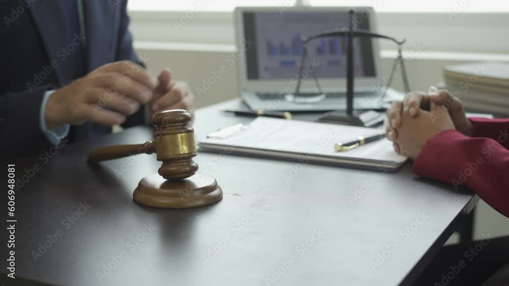 Justice and law concept, male judge in courtroom with hammer and scales working with computer, attorney hiring concept for lawsuit Video 4 k Justice and law concept, male judge in courtroom with hammer and scales working with computer, attorney hiring concept for lawsuit Video 4 k