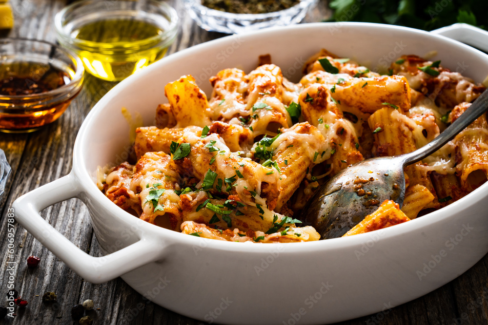 Noodle casserole with minced meat, mozzarella cheese and vegetables on wooden table
Noodle casserole with minced meat, mozzarella cheese and vegetables on wooden table