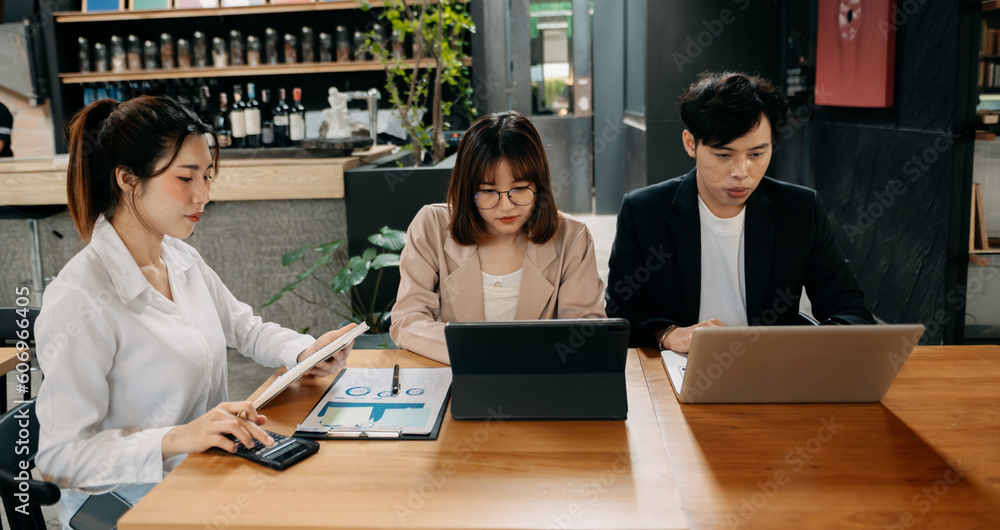 Female discussing new project with male colleague. Mature woman talking with young woman i Female discussing new project with male colleague. Mature woman talking with young woman i