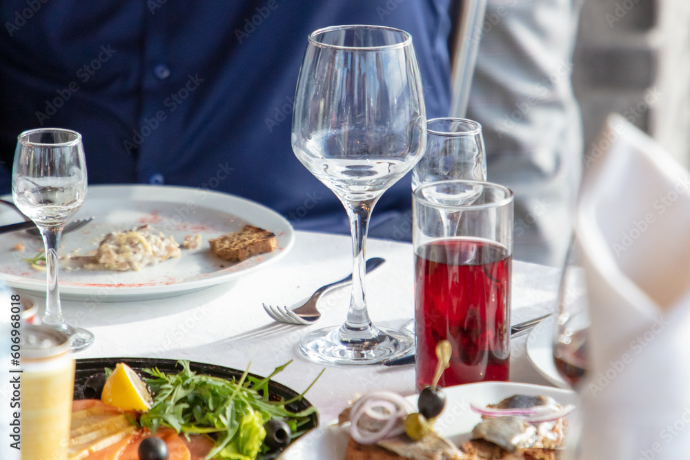 Restaurant table set with wine glasses and snacks Restaurant table set with wine glasses and snacks